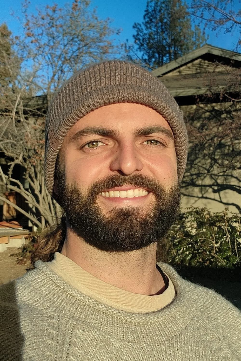 Lucas Carvalho, smiling in winter sun